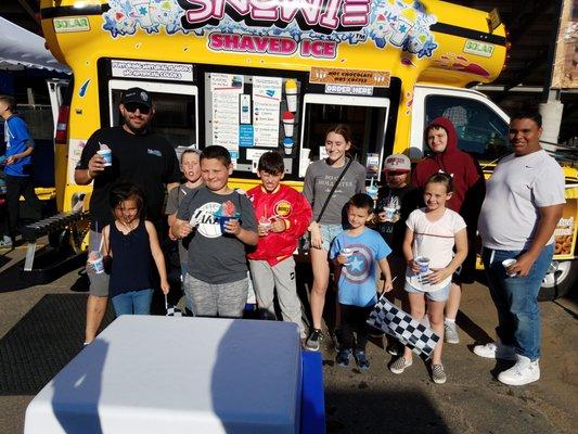 One happy family cooling off at the races with Snowie