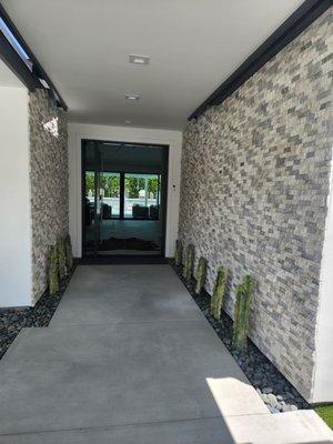 Gorgeous stacked stone on our front entry walls from SW Boulder!