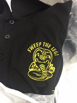 Custom embroidered "sweep the leg" shirts for a golf tournament