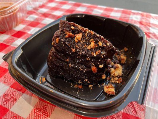 Turtle chocolate cake with caramel and crushed praline pecans