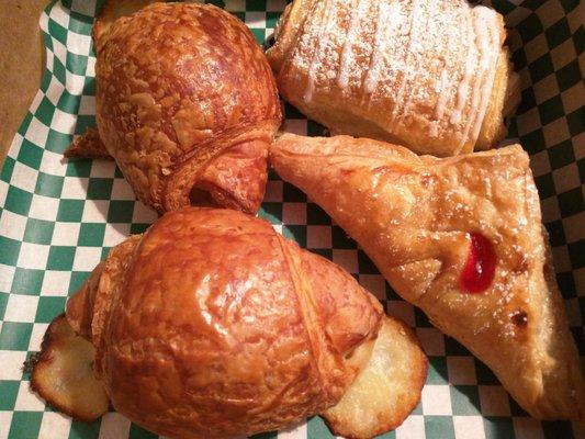 Two ham and cheese croissants, a blueberry cream cheese and cherry turnover.