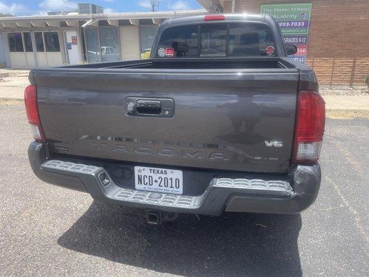 The back of the truck in front of the business that it was hit it was parked