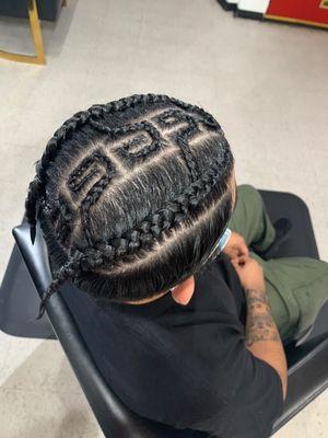 2 cornrows with a freestyle design