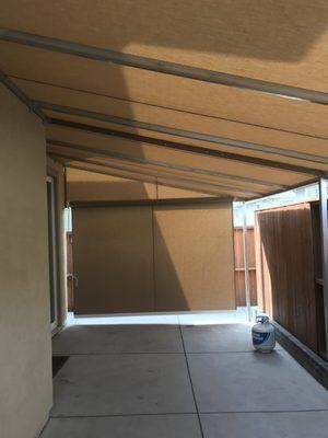 Custom shade added to patio structure for additional coverage