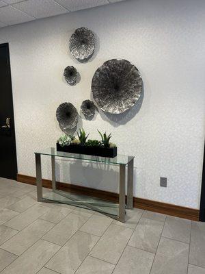 The art is outside of the first-floor elevators in the Novant Health Primary Care Lindley Park building.