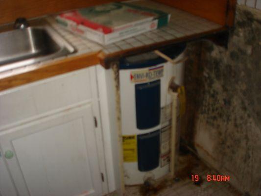 Before kitchen with mold damage.