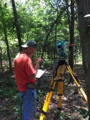 Surveying old school way, where a GPS want do the job because of trees