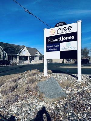 Rise Therapy & Wellness - photo of sign and entrance to building.