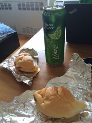 Ham and egg on a roll with a bud light lime