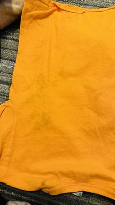 They admitted to using a cheap detergent which ruined my sons shirt