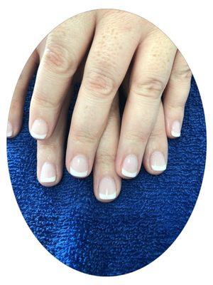 Dipping powder with French on natural nail.