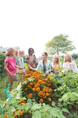 As part of Hayground's seed-to-table curriculum, students dig into the school's organic gardens and greenhouses.