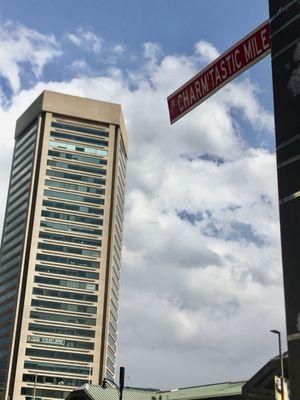 The World Trade Center in the background of the Iconic "Charm'tastic Mile" Street Sign.