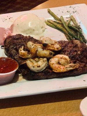 Texas Ribeye (medium-well) with mashed potatoes asparagus and added grilled Shrimp