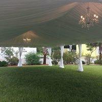 20x50 Tent with tent Drapping and Chandeliers.