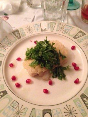 Olive oil poached cod with a Parmesan crisp and arugula