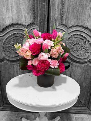 Brighten any occasion with our Pink Petal Symphony Bouquet! Bursting with Ranunculus, carnations, tulips, and roses. Shop now!