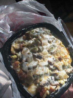 Loaded baked potato.  Broccoli, onions, bell peppers,  fried chicken, steak, sour cream, mushrooms