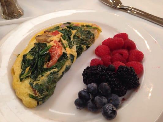 Omelette with spinach, tomato, mushroom, cheese & ham from their omelette station along with a side of fruit!