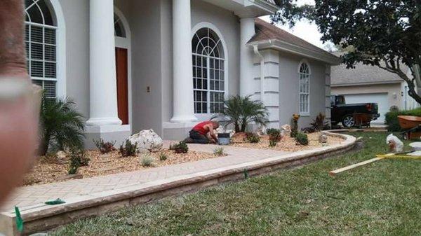 Nice makeover with complete landscape stone, pavers and border stones and plants and new front lawn..nice elegant look