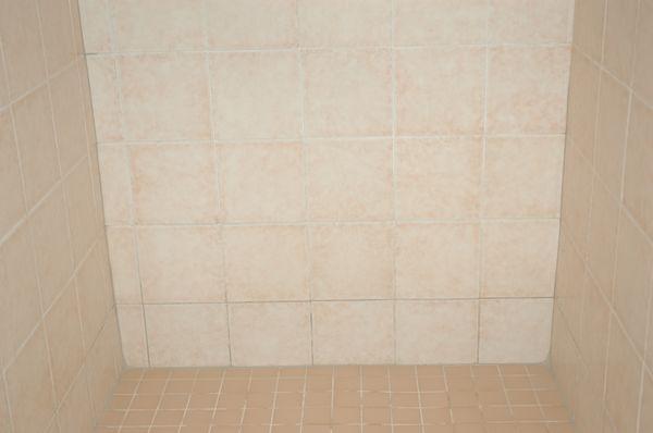 bottom row of tiles grouted in another color