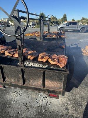 Mesquite charcoal cooked ribs and chicken.