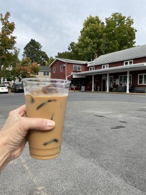 My delicious iced Americano in front of the shop!