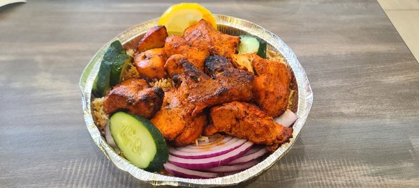 Chicken Tikka Kabab (Boneless cubes of Chicken marinated in exotic spices and grilled in traditional Tandoor Oven)