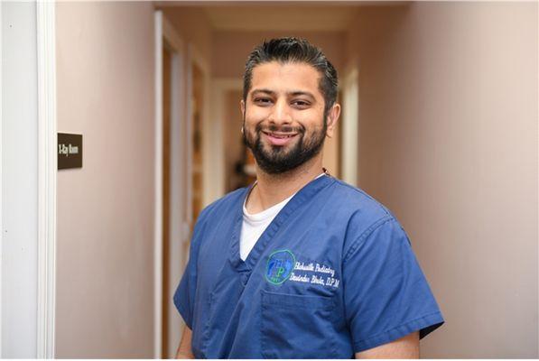 Dr. Davinder Bhela in scrubs