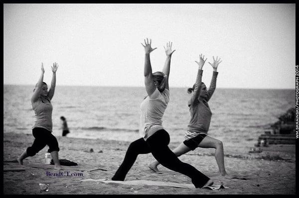 yoga on the beach as part of the sunset paddle and yoga