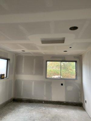 Finished garage. Floors and walls swept clean free of dust and debris ready for primer and painting. #drywall #Burien