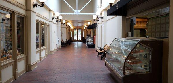 The two sweet cases in the hallway of the indoor mall old school mall property.