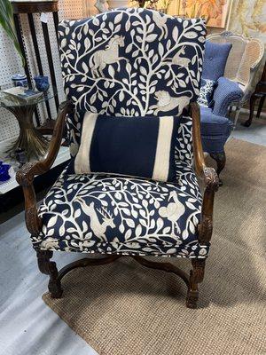 Chair with a beautiful navy and cream covering.