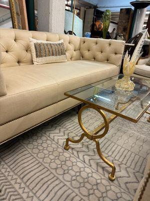 Councill COL300 tufted sofa, vintage French Jacques Adnet style coffee table, Murano glass pheasant with gold leaf, and a Surya Pisa carpet.