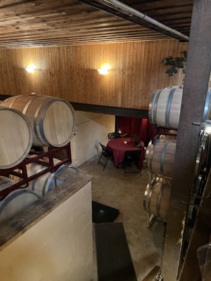 There's 10-12 various sized tables in the wine cellar. Tables have table cloths, and candles. A nice ambiance!