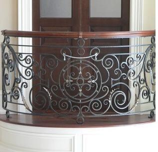 Custom scroll balcony rail with wood top