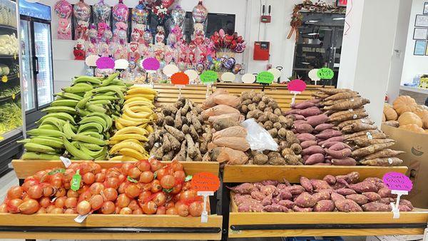 Produce section- green plantain, ripe plantain, sweet potato, onions, yuca/cassava, pumpkin