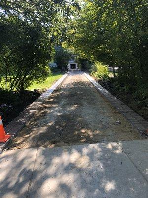 Measurements taken. Existing drive way removed.
Bricks placed & prepped for asphalt.