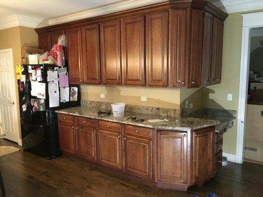 Before photo - cabinets in need of refinishing