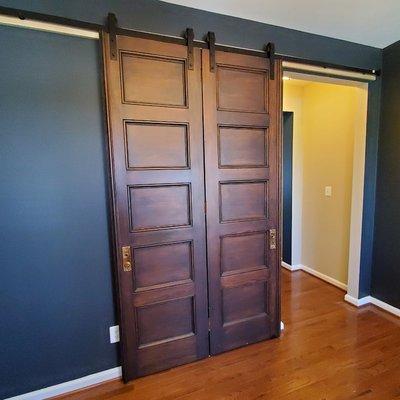 Installed new sliding barn door track and 7 ft. tall antique doors.