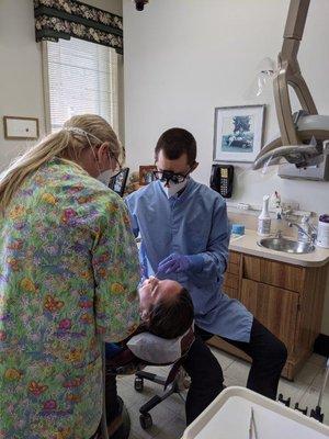 Gloversville dentist Dr. Devin Harrison performing root canal at Harrison Family Dentists