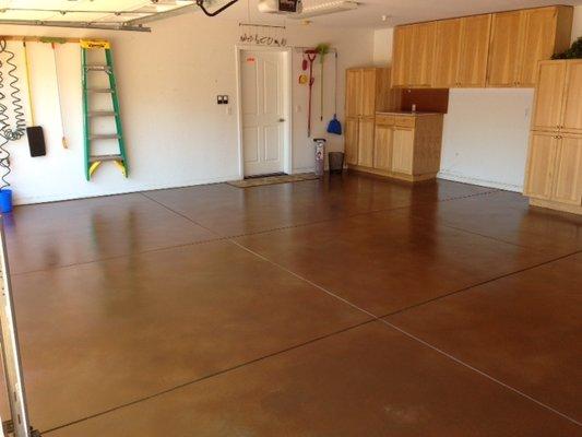 This floor started as a regular grey colored floor and we colored it with a top coat fast stain sealer which created this finished look.