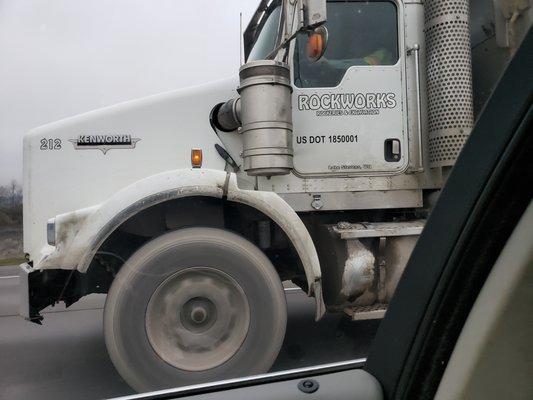 Rockworks truck dumping gravel on I5