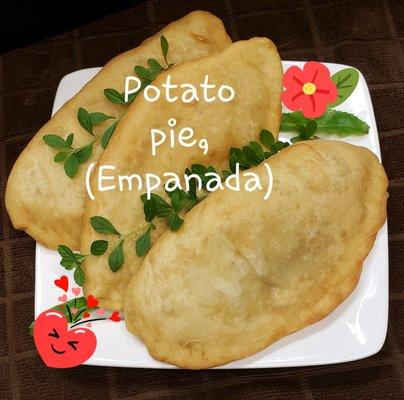 Potato pie, or EMPANADA. A lightly fried dough filled with potatoes, filling and satisfying. Contains wheat.