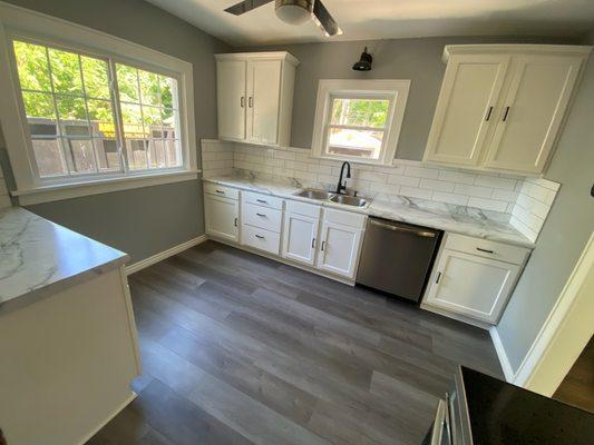 They hung Cabinets and DeAndre did the floors and backsplash