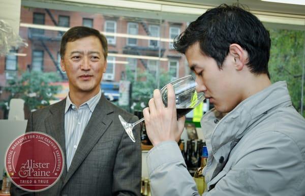 father Sam looks on as son Edlin picks up on floral notes