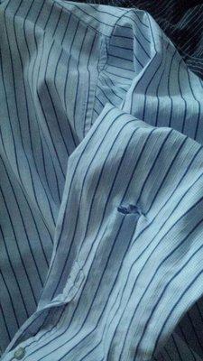 All the dress shirts has the same cuts at the left arm side. New and old dress shirts. The bottom front was burned too.