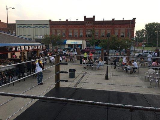 People gathering eating, drinking and ready for the Night's Boxing Matches. Three 1 minute Rounds.