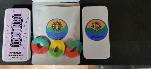 Click on photo for full effect A smattering of offerings.  (l.to r.)  CBD Prerolls -   Sour Neon Gummies  -  Pre-rolled Gelato.