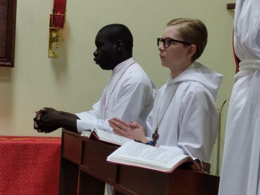 Acolytes at prayer in worship!